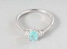 AN 18CT WHITE GOLD THREE STONE PARAIBA TOURMALINE (0.47cts) AND DIAMOND (0.18cts) RING.