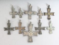 TEN SMALL ROMAN CROSSES.