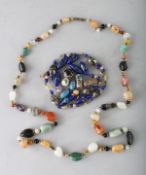 AN ITALIAN COLOURED GLASS BAG OF BEADS and A HARDSTONE NECKLACE.