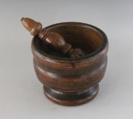 A LATE 18TH CENTURY TURNED FRUITWOOD PESTLE AND MORTAR.