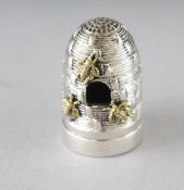 A SILVER BEEHIVE PIN CUSHION. 1.25ins