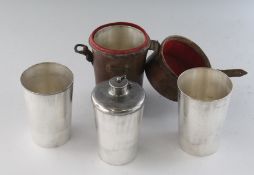 A FLASK AND BEAKER set in a leather case. 7ins.