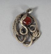 A SILVER SNAKE PENDANT.