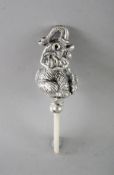 A SILVER AND MOTHER-OF-PEARL ELEPHANT RATTLE.