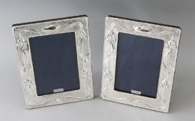 A PAIR OF SILVER PHOTOGRAPH FRAMES. 7.5ins x 5.5ins.