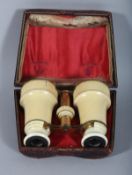 A PALAIS ROYAL IVORY CASED PAIR OF OPERA GLASSES. 3.25ins, closed.