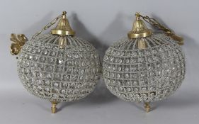 A PAIR OF CIRCULAR BEAD LIGHTS. 15ins long.