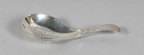 A GEORGE III BRIGHT CUT CADDY SPOON. London 1809.