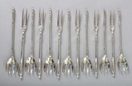 A BOX OF CONTINENTAL SILVER PASTRY/SHELL FISH FORKS.