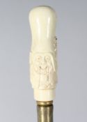 A CARVED BONE CHINAMAN HANDLE WALKING STICK. 36ins long.