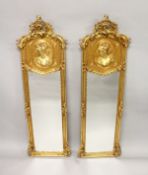 A LONG PAIR OF GILTWOOD MIRRORS. 5ft 8ins high x 1ft 9ins wide.