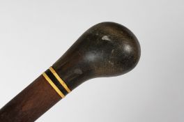 A RHINO HANDLE WALKING CANE. 34ins long.