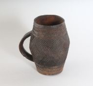 A LUBA CARVED CUP.