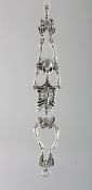A HEAVY SILVER SKELETON BRACELET.