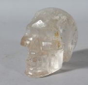 A CARVED ROCK CRYSTAL SKULL. 4.5ins.