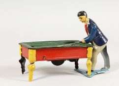 A SMALL GERMAN TIN PLATE CLOCKWORK BAR BILLIARD GAME. 6ins long.