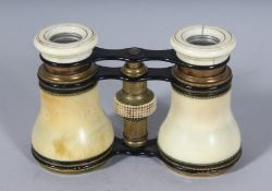 AN IVORY CASED PAIR OF OPERA GLASSES. 2.5ins, closed.