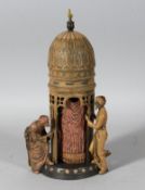 A VIENNA COLD PAINTED BRONZE TOWER with two men and a nude. 12ins high.