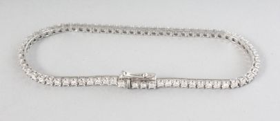 AN 18CT WHITE GOLD SEVENTY CLAW LINE DIAMOND BRACELET, 2.0cts.