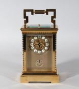 A VERY GOOD 19TH CENTURY FRENCH BRASS CARRIAGE REPEATER CLOCK. 6.5ins high.