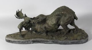 A LARGE BRONZE MOOSE on a marble base. Signed. 23ins long.