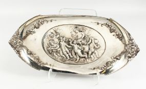 A WMF ART NOUVEAU PEWTER DISH, the centre embossed with playful cherubs, the handles cast as