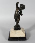 AN 18TH CENTURY BRONZE CUPID on a marble base. 9.5ins high.