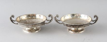 A PAIR OF TWO-HANDLED SILVER CIRCULAR TAZZAS. 4ins diameter. Birmingham 1911.