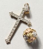 A 9CT GOLD DIAMOND SET CROSS AND BALL.