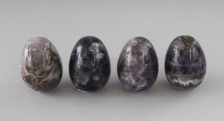 FOUR SMALL FELDSPAR EGGS.