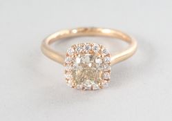 AN 18CT YELLOW GOLD SINGLE STONE CUSHION CHAMPAGNE DIAMOND RING, 1.24cts, surrounded by diamonds,