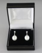 A GOOD PAIR OF PEARL AND DIAMOND DROP EARRINGS.