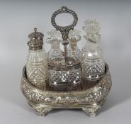A GEORGE IV SEVEN BOTTLE SILVER CRUET, repousse decoration on shell feet. London 1827.