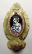 A GOOD LATE 19TH CENTURY ONYX AND CHAMPLEVE ENAMEL HOLY WATER FONT, mounted with an oval enamel