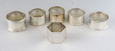 SIX VARIOUS SILVER SERVIETTE RINGS. Weight 7ozs.