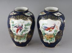 A PAIR OF BOOTHS POTTERY WORCESTER DESIGN VASES. 5ins high.