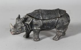 A BRONZE RHINO INKWELL. 6.5ins long.