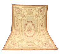 AN AUBUSSON STYLE TAPESTRY WALL HANGING, beige ground decorated with floral panels. 9ft 0ins x 6ft