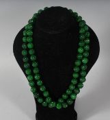 A SUPERB STRING OF JADE with 18ct gold clasp.