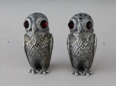 A PAIR OF CAST 800 OWL SALT AND PEPPERS. 2.5ins high.