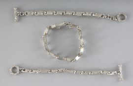 THREE SILVER BRACELETS.