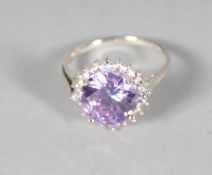 A SILVER BLUE TOPAZ RING.