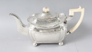 A GOOD GEORGE III IRISH SILVER TEAPOT with ivory finial and handle, engraved on four bun feet.