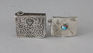 TWO SILVER STAMP CASES.