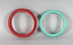 TWO CARVED CINNABAR LACQUER BANGLES.