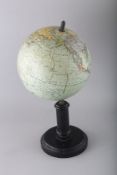 A G. THOMAS TERRESTRIAL GLOBE on a stand. 7.5ins diameter.