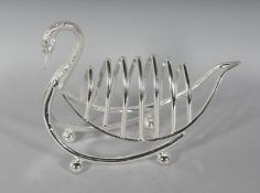 A SIX-DIVISION SWAN SHAPED TOAST RACK. 8ins long.