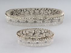 TWO SILVER ANGEL TOP GLASS PIN BOXES. 5.25ins and 3ins long. Birmingham 1914 and 1904 (2).