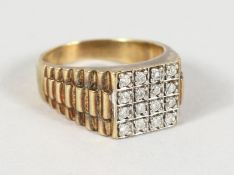 AN 18CT GOLD RING set with sixteen diamonds.
