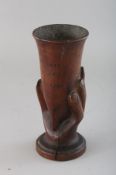 A SOUVENIR FROM PITCAIRN, carved wood hand holding a vase. 6.75ins high.
